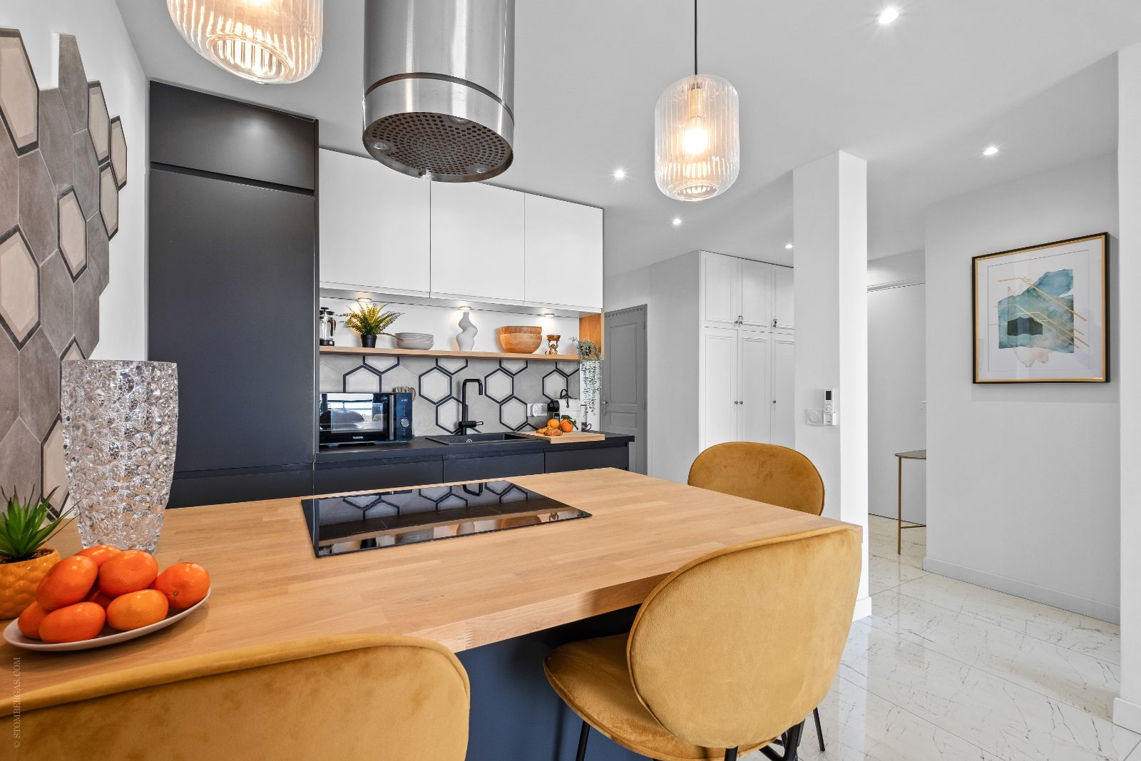 Kitchen with induction hob, oven, microwave and storage